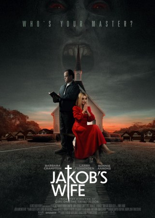Larry Fessenden stands in a dark suit while reading the Bible. Barbara Crampton sits next to him in a red dress. Behind them is a church with the ghostly image of a vampire looming behind it. Text reads, "Who's your master? Jakob's Wife."